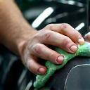 Technician detailing car with microfiber
