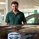 Customer smiling with freshly cleaned car