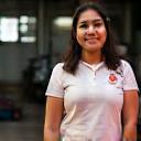 Priya Nair in front of company workshop